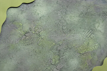 Flat lay on aged textured painted green brown background. Abstract cracked, crackled background....