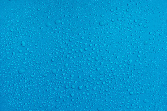 water drops close up on blue background