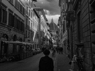 A beautiful grayscale shot of Florence downtown with the  view of Duomo Florence (cathedral of santa maria del fiore) in the background.