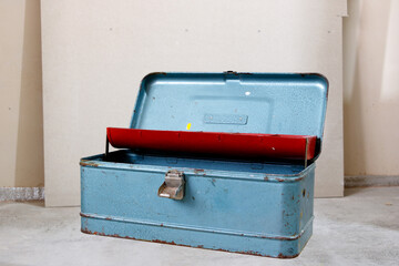 old metal suitcase with tool handle