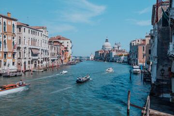 Grand Canal and Basilica of Santa Maria della Salute on a sunny day with blue skies. High quality photo