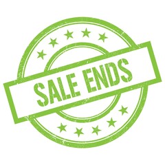 SALE ENDS text written on green vintage stamp.
