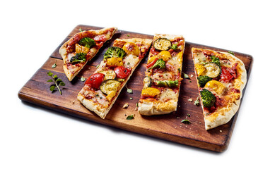 Pizza with vegetables on cutting board