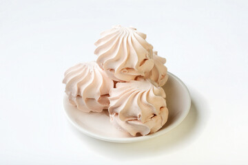 Sweets. Sweet apple marshmallows on a white plate. Marshmallow on a white background for insulation.
