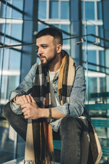 Pensive man sitting on steps