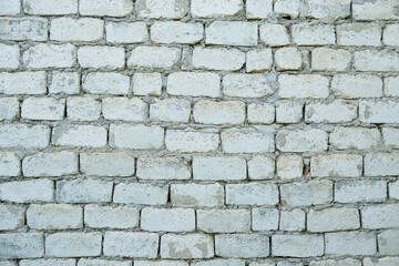 An old vintage wall made of white brick.