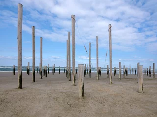 Fotobehang Palendorp op het strand van Petten © Holland-PhotostockNL