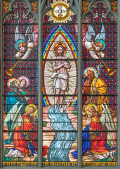 VIENNA, AUSTIRA - JUNI 24, 2021: The  Baptism of Jesus on the stained glass in the Votivkirche...