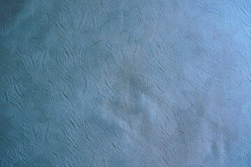 The texture of the material is grey genuine leather