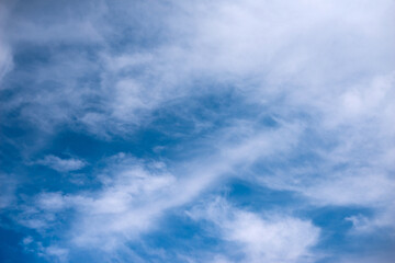 Scattered cloud clusters in a blue sky, blue sky background with white clouds,
