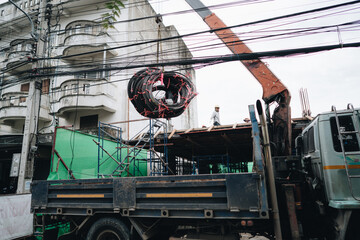 Chiang Mai, Thailand - 7 June 2020: a work with electric wires in the centre of the city