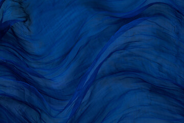abstract blue background with waves of fabric