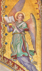 VIENNA, AUSTIRA - JUNI 24, 2021: The fresco of angel with the book in the Votivkirche church by brothers Carl and Franz Jobst (sc. half of 19. cent.).