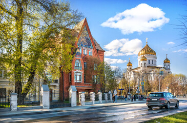 Pertsova's apartment building on the embankment of the Moskva River and the Cathedral of Christ the Savior in Moscow