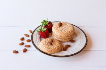 Useful Lenten cookies from almond flour with strawberry on rustic wooden background. selective focus