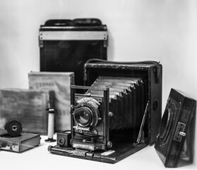 Folding bed plate medium format vintage film camera. Old bellows photo camera isolated on white...