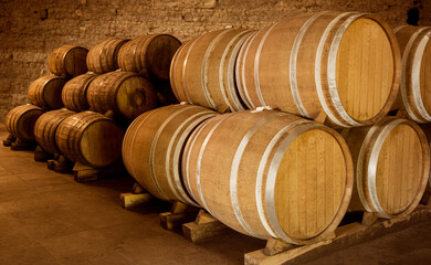 Wine barrels on old cellar. Warm and desaturated tones