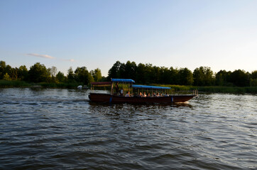 Fototapeta premium boat on the river in the evening