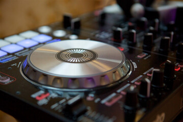 Fototapeta na wymiar DJ remote to control the sound while recording music