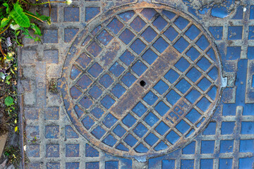 Sewer cast-iron manholes in the city.