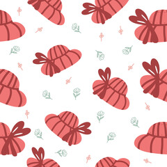 Seamless vector pattern with cute bright red hats and autumn flowers, a cozy autumn theme in a cartoon style.