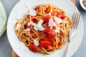 Tomato pasta with cheese on plate