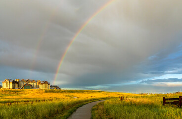 The stormy sky and rainbow above the new Gaylord Rockies Resort and Convention Center in Denver,...