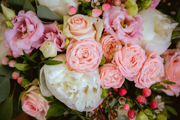 Beautiful, wedding bouquet made from pink roses and white peonies, with mixed fresh flowers