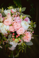 Beautiful, wedding bouquet made from pink roses and white peonies, with mixed fresh flowers