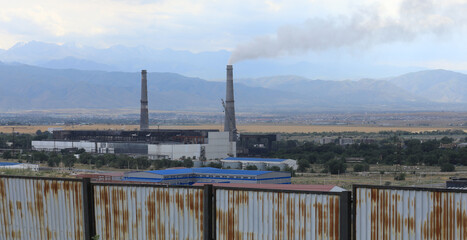 Fototapeta na wymiar smoke from industrial chimneys on the landscape