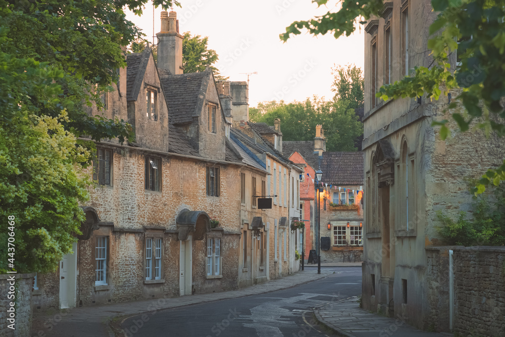 Wall mural The historic quaint old market town centre of Corsham, Wiltshire during golden hour on a summer evening in England.