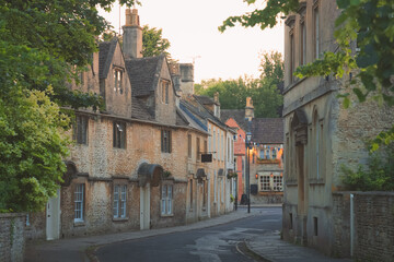 The historic quaint old market town centre of Corsham, Wiltshire during golden hour on a summer evening in England.