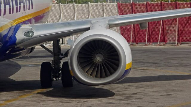 Commercial airplane starts jet engine attached to the wing