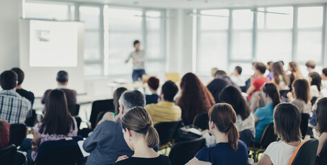 Speaker giving presentation on business conference. - obrazy, fototapety, plakaty