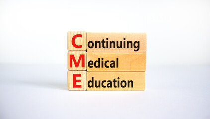 CME, continuing medical education symbol. Wooden blocks with words CME, continuing medical education on beautiful white background. Business, CME, continuing medical education concept.