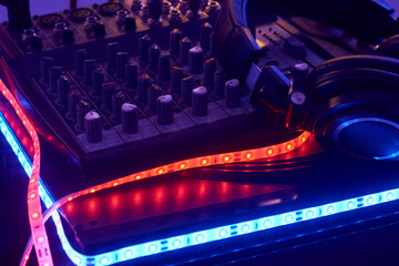DJ mixing console with headphones