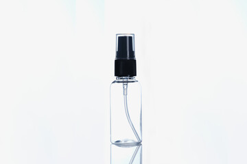 Closeup of glass jar with cosmetic oil on white background