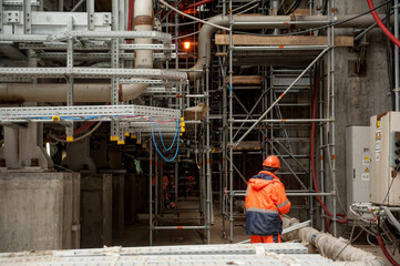 Worker on construction site of gas factory