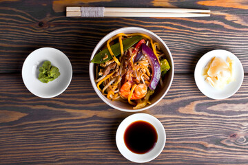 oriental dish with shrimps, chicken and vegetables