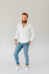Studio photo of a beautiful young man with a beard