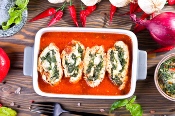 chicken rolls with spinach and mozzarella in tomato sauce