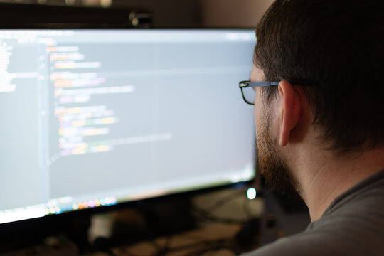 Software Engineer working from home debugging code