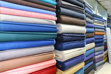 dowry and dress fabrics in accordance with Turkish traditions. bridal fabrics. Colorful fabrics were lined up on the shelves of the fabric store. selective focus