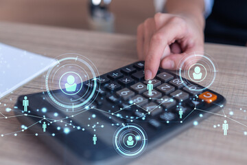 HR specialist researching and analyzing the data of salary on employment market to forecast ongoing expenses of the company. Hiring new talented officers. Social media hologram icons. Woman hand.