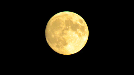 Full yellow moon on a black sky background - Powered by Adobe