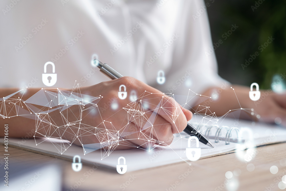 Aufkleber businesswoman is taking notes of clients needs to protect cyber security from hacker attacks and sav