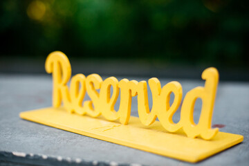 Reserved sign on a table in a cafe