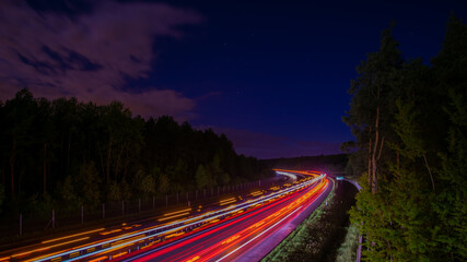 Night road lights. Lights of moving cars at night. long exposure