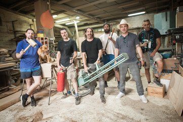 Group of funny workers make comedy and posing with tools