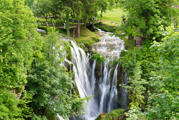 Naklejka premium Beautiful waterfall in Slunj, Croatia during summer season. Travel destination in croatia, must visit concept